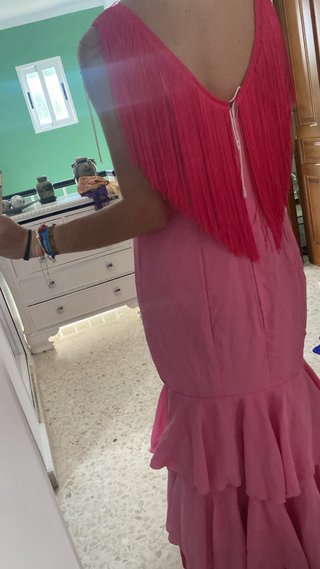 Traje de flamenca rosa con volantes