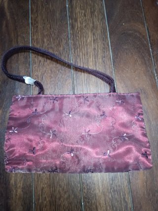 Bolso de fiesta Menbur granate.
