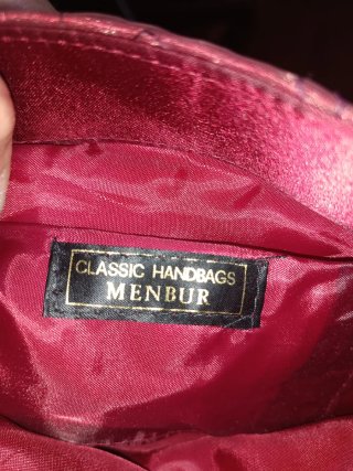 Bolso de fiesta Menbur granate.