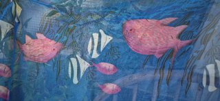 Pareo azul con peces y motivos marinos