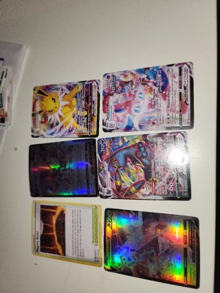 Cartas Pokémon VMAX y Trainer