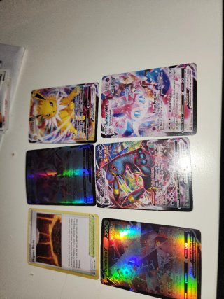 Cartas Pokémon VMAX y Trainer