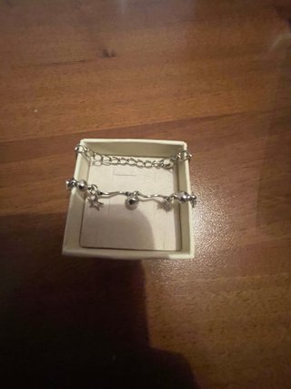 Braccialetto metallo con pendenti stelle