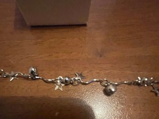 Braccialetto metallo con pendenti stelle