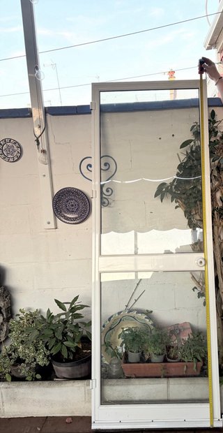 Puerta aluminio y cristal.Sin premarco