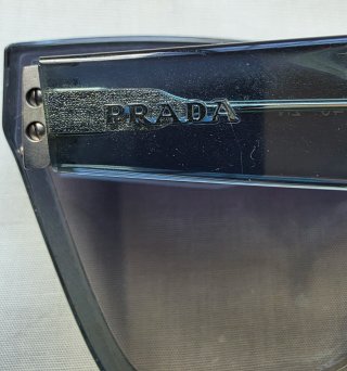 Gafas de sol Prada pantalla celeste y plateado