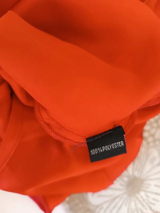 Top Camomilla rosso con paillettes