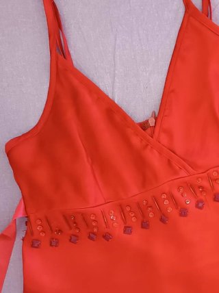 Top Camomilla rosso con paillettes