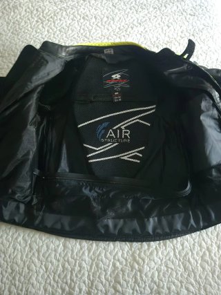 Chaqueta de moto SPIDI negra y flúor