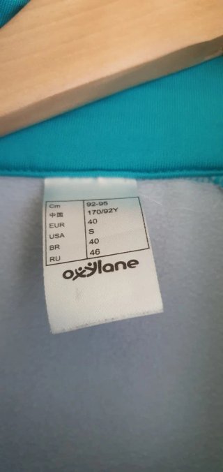 Chaqueta deportiva Kalenji gris y turquesa