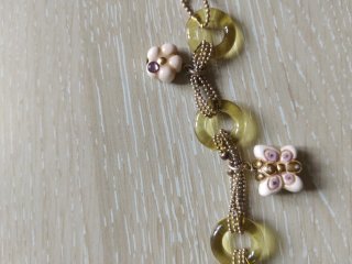 Bracciale Thun dorato con dettagli floreali