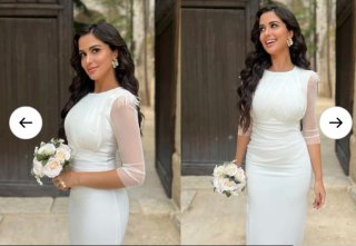 Vestido blanco elegante con plumas