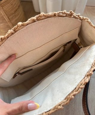 Bolso redondo rafia Parfois con borlas