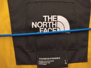 Plumífero The North Face Negro y Amarillo
