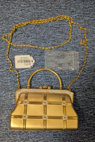 Bolso de fiesta dorado con pedrería
