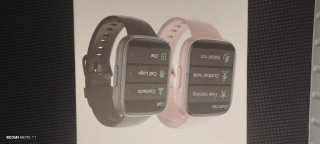 Reloj inteligente rosa con cargador
