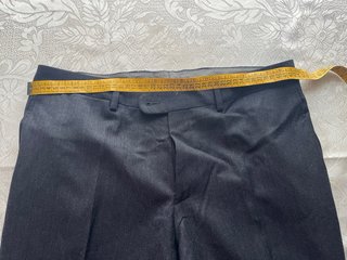 Pantalones de sastrería fin de Stock