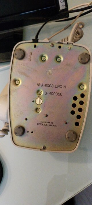 Teléfono antiguo de disco beige años 70