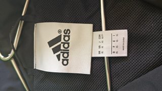 Chaqueta deportiva Adidas negra y verde