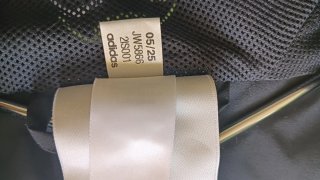 Chaqueta deportiva Adidas negra y verde
