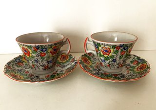 Par de tazas/platillos en porcelana del Japón