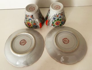 Par de tazas/platillos en porcelana del Japón