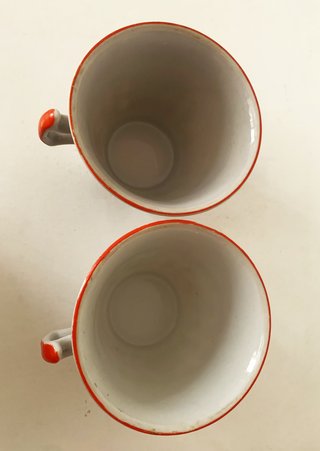 Par de tazas/platillos en porcelana del Japón