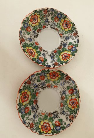 Par de tazas/platillos en porcelana del Japón
