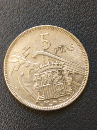 Moneda 5 pesetas 1957 con error acuñación espejo.