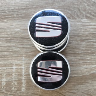 TAPABUJES SEAT 56mm NEGROS - EMBLEMA LLANTAS SEAT