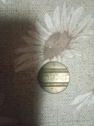 Moneda antigua de teléfonos