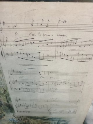 Partitura francesa antigua con paisaje.