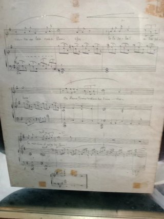 Partitura francesa antigua con paisaje.