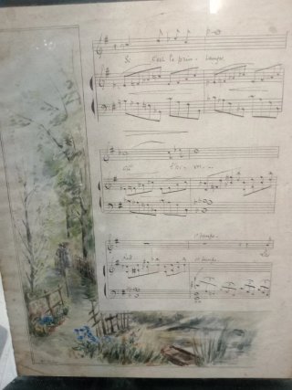Partitura francesa antigua con paisaje.