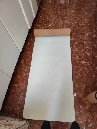 Esterilla de yoga enrollada