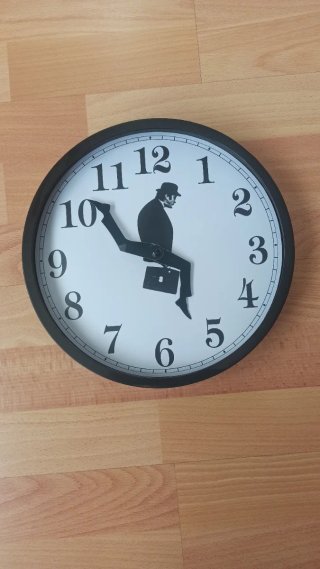 Reloj de pared original hombre sentado - Nuevo