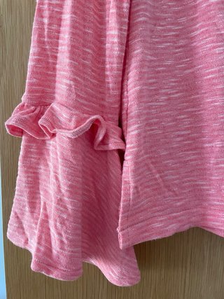 Camiseta rosa manga larga con volantes