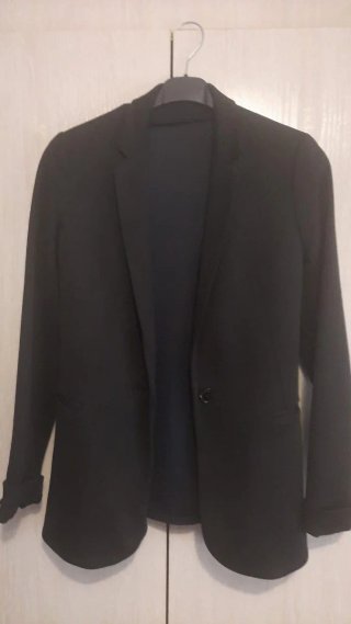 Traje negro chaqueta y pantalón