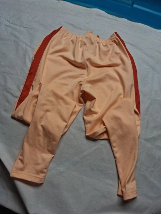 Pantalón chándal Nike naranja y rojo