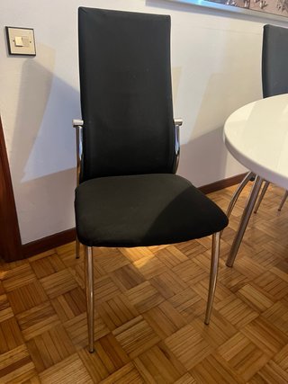 Mesa comedor ovalada y 6 sillas negras