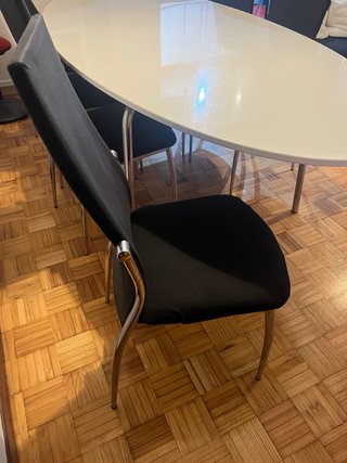 Mesa comedor ovalada y 6 sillas negras