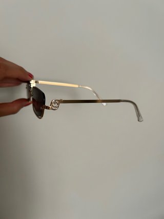 Occhiali da sole neri e oro