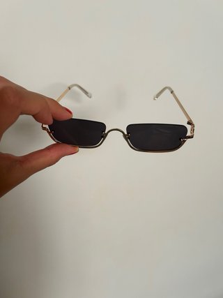 Occhiali da sole neri e oro