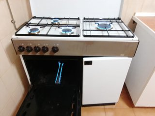 Cocina de gas con horno y espacio para bombona
