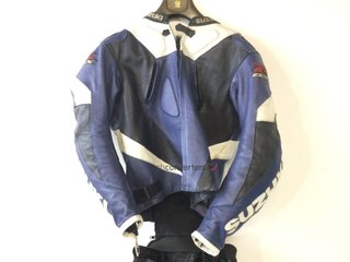 proteccion motorista suzuki mono 2 piezas