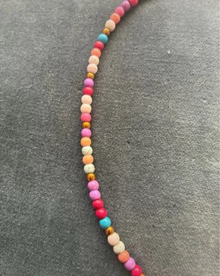 Collar de cuentas con colgantes de pez y estrella