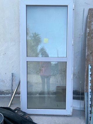 Balconera de PVC, doble cristal Climalit con reja.