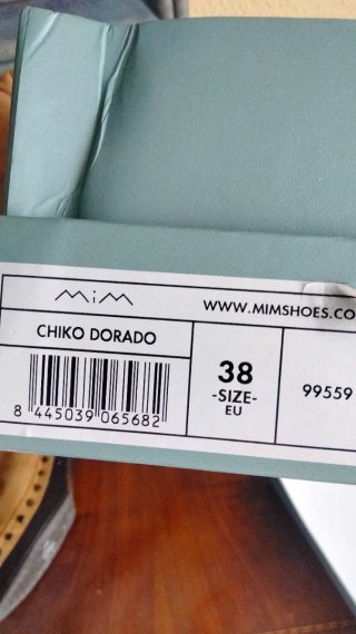 Zuecos de piel beige y marrón