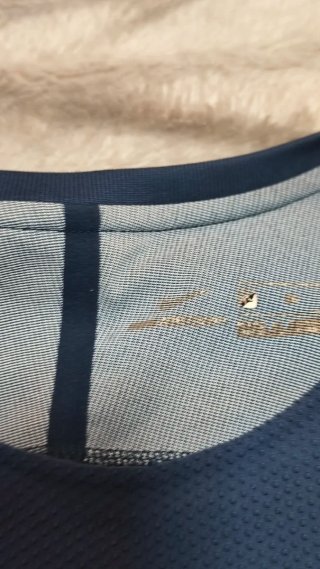 Camiseta deportiva Nike azul y gris