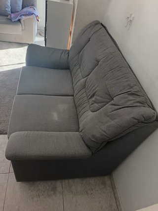 Dos sofás grises de tela